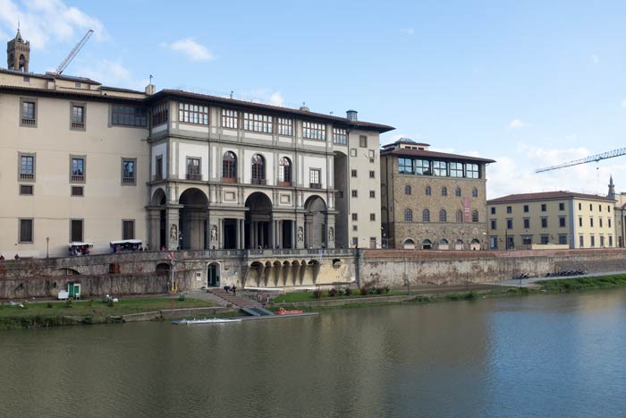 The Uffizi Gallery in Florence viewed from the-opposite bank of the River Arno